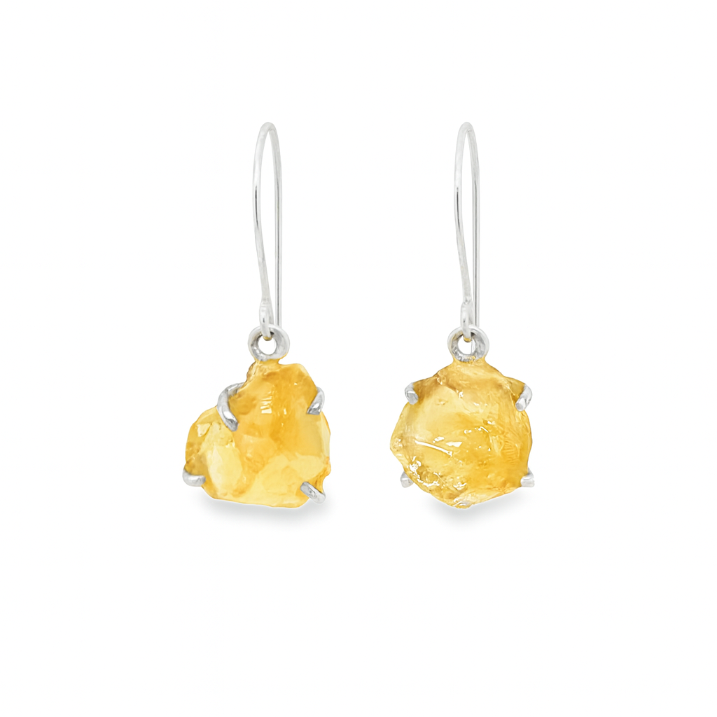 Pair of citrine stone earrings on a white background