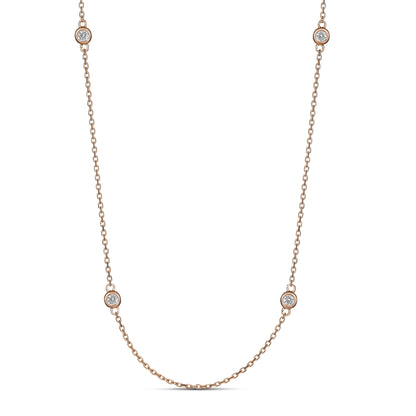 A 9ct rose gold necklace with bezel set diamonds along the chain, displayed on a white background.